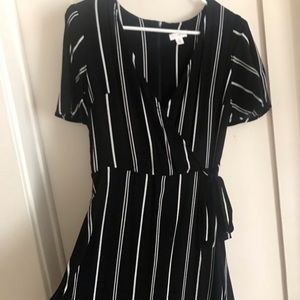 Black and white surplice dress.